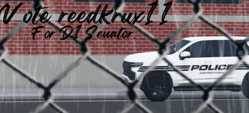 a white police car is driving down the street