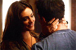 a man and a woman are looking into each other 's eyes