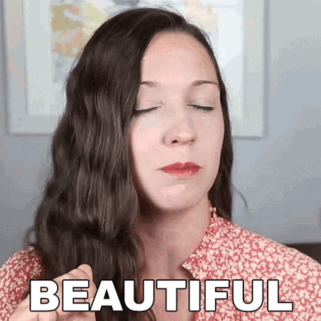 a woman with her eyes closed has the word beautiful above her head
