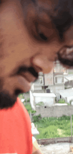 a close up of a man 's face with a beard