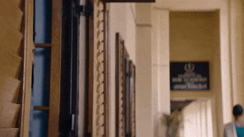 a hallway with a sign on the wall that says ' i '