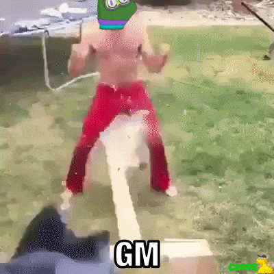 a shirtless man in red pants is standing next to a white pipe with the word gm written on it