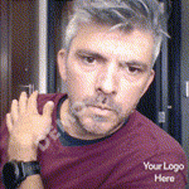 a man wearing a maroon shirt that says your logo here on it