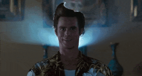 a man in a hawaiian shirt is making a face