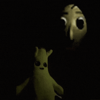 a yellow stuffed animal is standing next to a person with a mask on their face