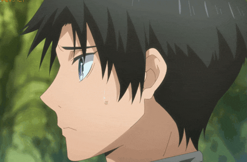 a close up of a person 's face with a tear coming out of his eye
