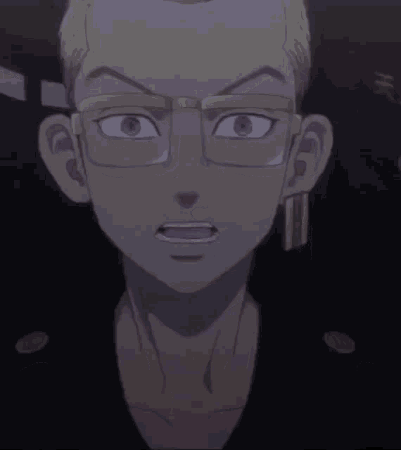 a close up of a man 's face with glasses