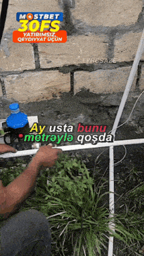 a man is working on a pipe with the words mostbet 30fs written on the top