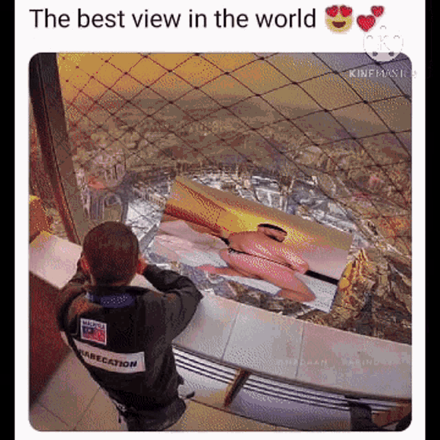 a man standing on a balcony looking at a picture of a woman with the words the best view in the world below him