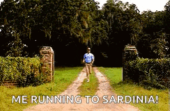 a man is running down a dirt road with the words `` me running to sardinia '' written on the bottom .