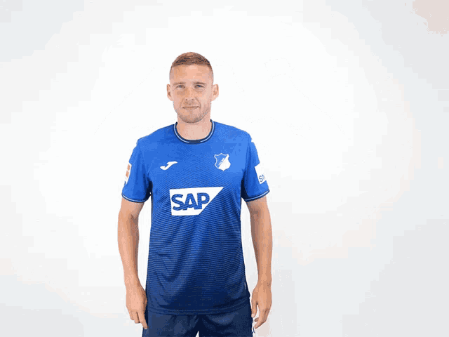 a man wearing a blue shirt with the number 3 on the back