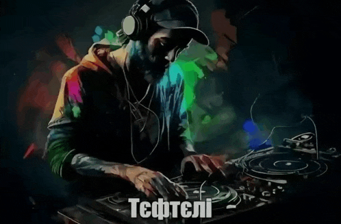 a man wearing headphones is playing music on a turntable