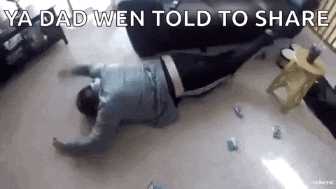 a man is laying on the floor in a living room with the words `` ya dad wen told to share '' .