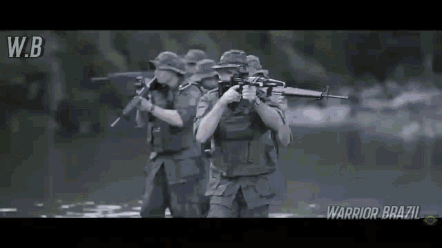 a group of soldiers holding guns in the water with the words warrior brazil on the bottom right