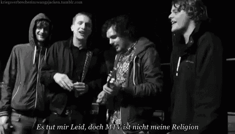 a group of young men standing next to each other with a caption that says es tut mir leid