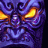 a close up of a purple and orange tiki mask with yellow eyes .