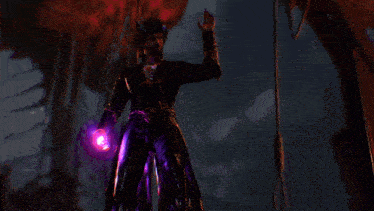 a hand is holding a purple object with a star in the middle