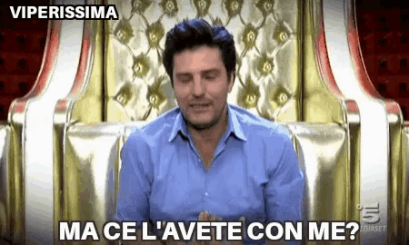a man in a blue shirt is sitting in a chair with the words viperissima on the bottom