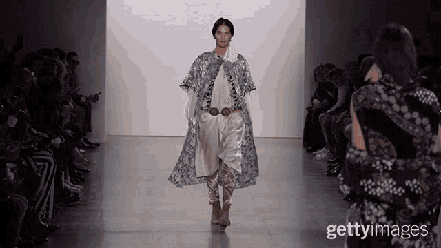 a model walks the runway at a fashion show sponsored by gettyimages