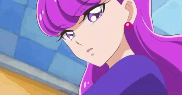 a close up of a purple haired anime girl wearing a blue shirt and earrings .