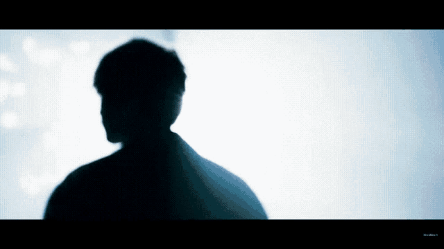 a silhouette of a man is against a white background with the word blue visible