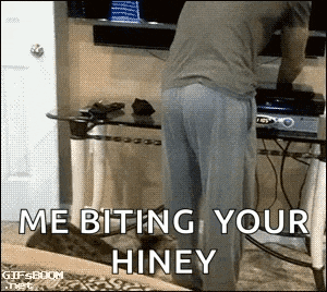 a man is standing next to a cat that says me biting your hiney