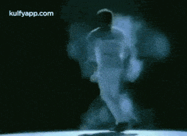 a man in a white karate uniform is jumping in the air ..