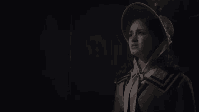 a woman wearing a hat and a coat says please