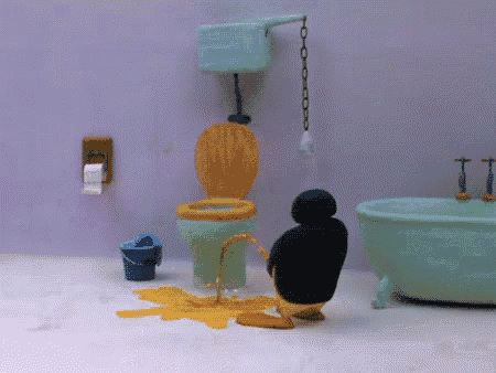a penguin is urinating in a bathroom next to a bathtub and toilet