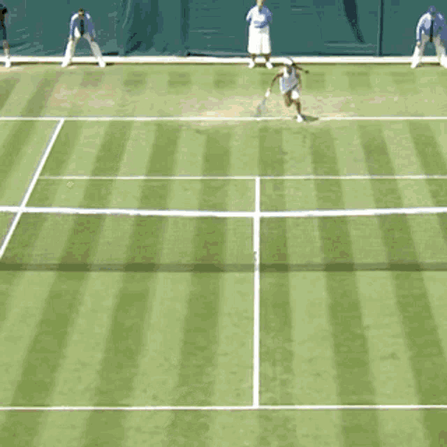 a woman in a white dress is holding a tennis racquet