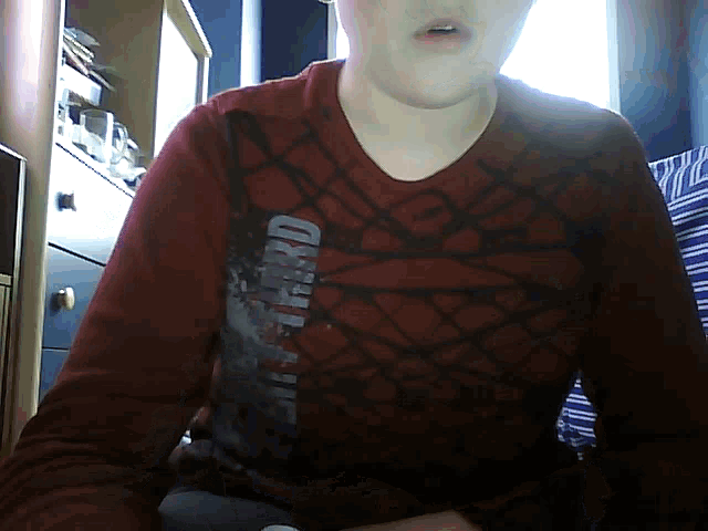 a person wearing a red shirt that says third