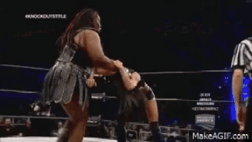 a woman in a wrestling ring with a makeagif.com watermark on the bottom