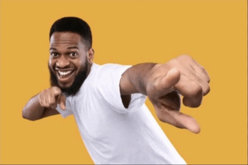 a man in a white shirt is pointing to the camera