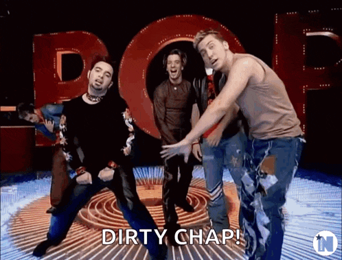 a group of men are dancing in front of a sign that says " dirty chap "