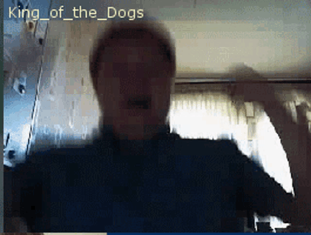 a blurry picture of a man with the words king of the dogs on the bottom