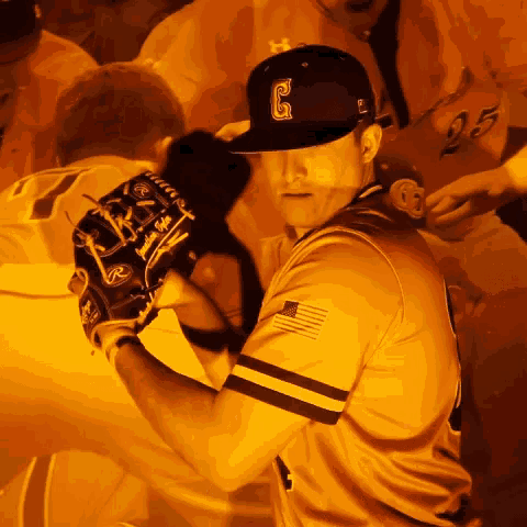 a baseball player with the letter g on his cap
