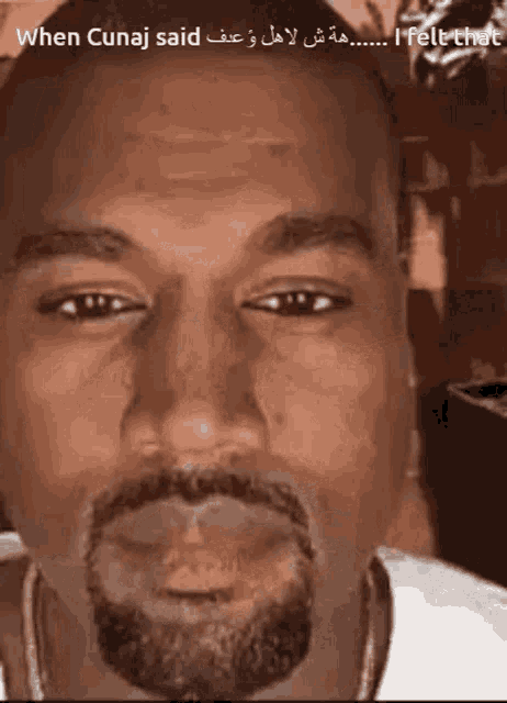 a close up of a man 's face with the words " when cunaj said i felt that " below it