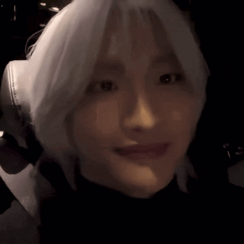 a close up of a person 's face with headphones on