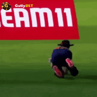 a man is kneeling down in front of a sign that says eam11