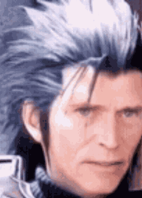 a close up of a man 's face with blue hair and a tear in his eye .