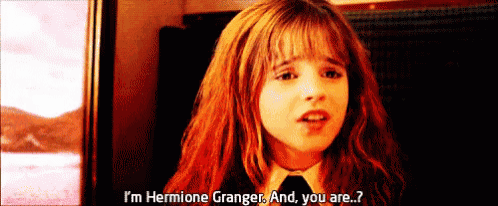 a young girl with red hair is talking to hermione granger