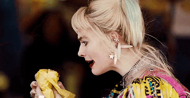 a close up of a woman eating a banana in a movie .