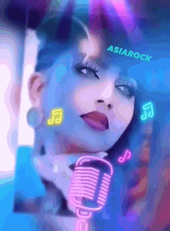 a woman singing into a microphone with asianrock written on the top