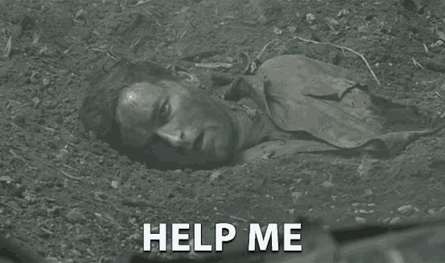 a man is laying in the dirt with the words help me written on the bottom