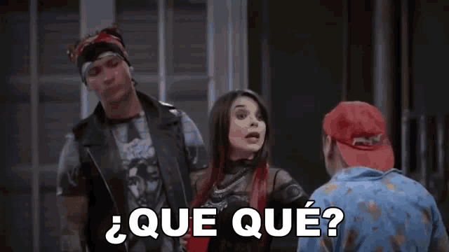 a man and a woman are standing next to each other with the words que que written in white