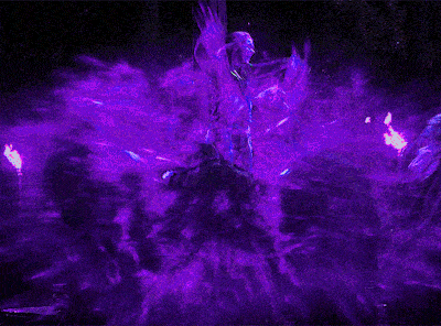 a person is surrounded by purple smoke and flames in a dark room