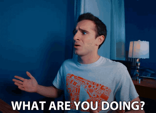 a man wearing a t-shirt that says " what are you doing "