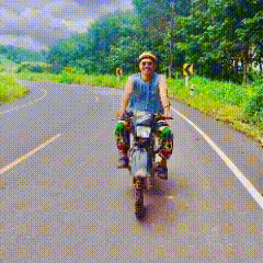 a man is riding a motorcycle on a road