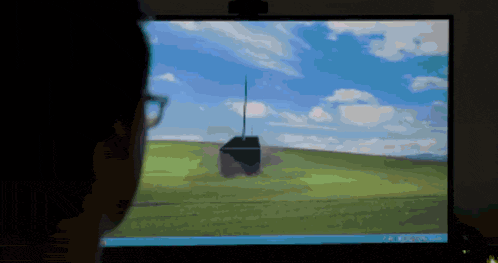 a person is looking at a computer screen that says ' a ' on it