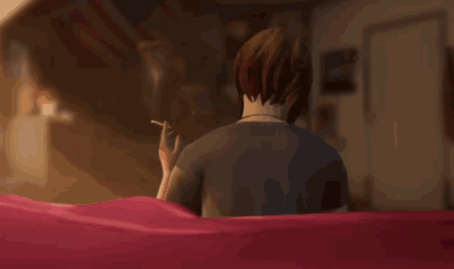 a man is smoking a cigarette in a room